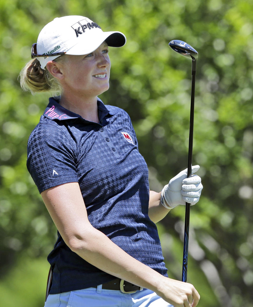 Stacy Lewis watches her tee shot on the second hole during the third round of the North Texas LPGA Shootout golf tournament at the Las Colinas Country Club in Irving, Texas, Saturday, May 3, 2014. (AP Photo/LM Otero)