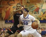 Creighton guard Baylor Scheierman (55) is guarded by Texas Tech forward Kevin Obanor (0) during the first half of an NCAA college basketball game, Monday, Nov. 21, 2022, in Lahaina, HI. (AP Photo/Marco Garcia)