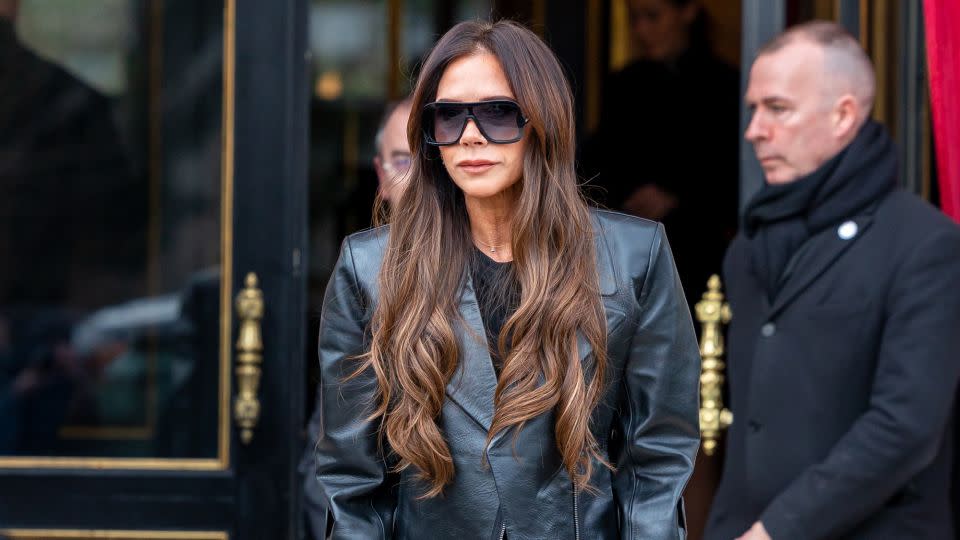 And even with a serious foot injury, Victoria will still deliver a sleek, tailored look — only now her outfits are completed with an all-black customizable walking aid, from UK brand "Cool Crutches." - Marc Piasecki/GC Images/Getty Images