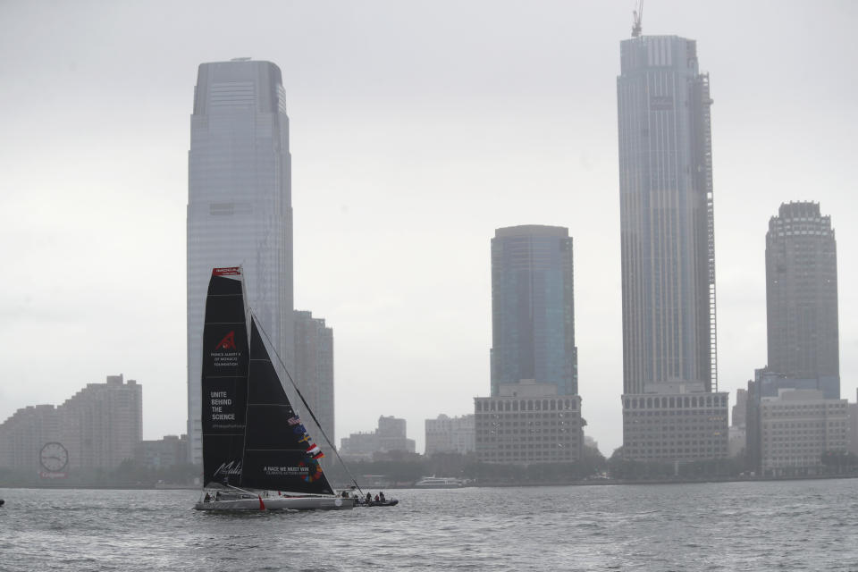 Greta Thunberg, a 16-year-old Swedish climate activist, sails into New York harbor aboard the Malizia II, Wednesday, Aug. 28, 2019. The zero-emissions yacht left Plymouth, England on Aug. 14. She is scheduled to address the United Nations Climate Action Summit on Sept. 23. (AP Photo/Mary Altaffer)