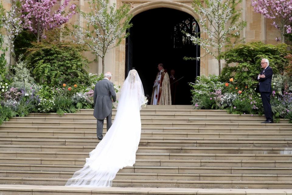 The bride and her father walking to the chapel