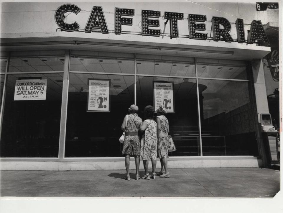 In 1973, customers peer into the Concord Cafeteria in South Beach while the restaurant was under repairs after a firebombing. Miami Herald File