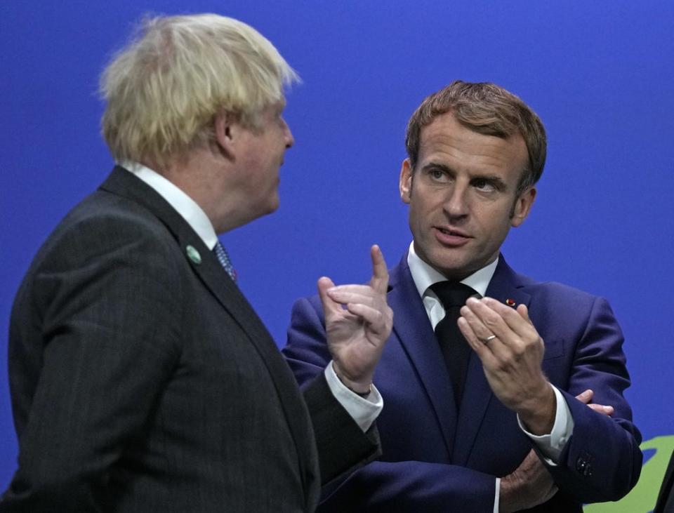 Prime Minister Boris Johnson greets French President Emmanuel Macron at the Cop26 summit (Alastair Grant/PA) (PA Wire)