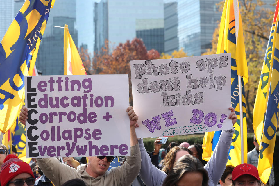 Members of CUPE education workers and other supporters amass at Queens Park to protest a day after the Provincial Government enacted the Not Withstanding Clause of the Canadian Constitution to legislate a contract on the union