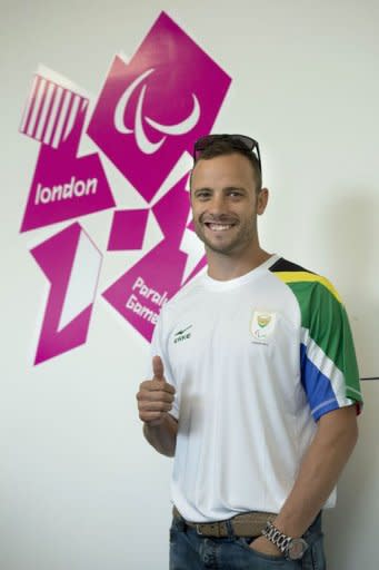 South Africa's double amputee runner Oscar Pistorius poses during a press conference ahead of the London 2012 Paralympic Games in the Olympic park in east London