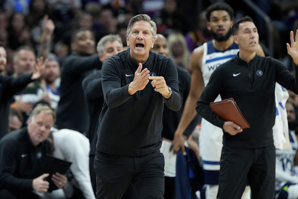 Minnesota Timberwolves head coach hChris Finch calls times out during the second half of Game 3 of an NBA basketball first-round playoff series against the Phoenix Suns, Friday, April 26, 2024, in Phoenix. (AP Photo/Matt York)