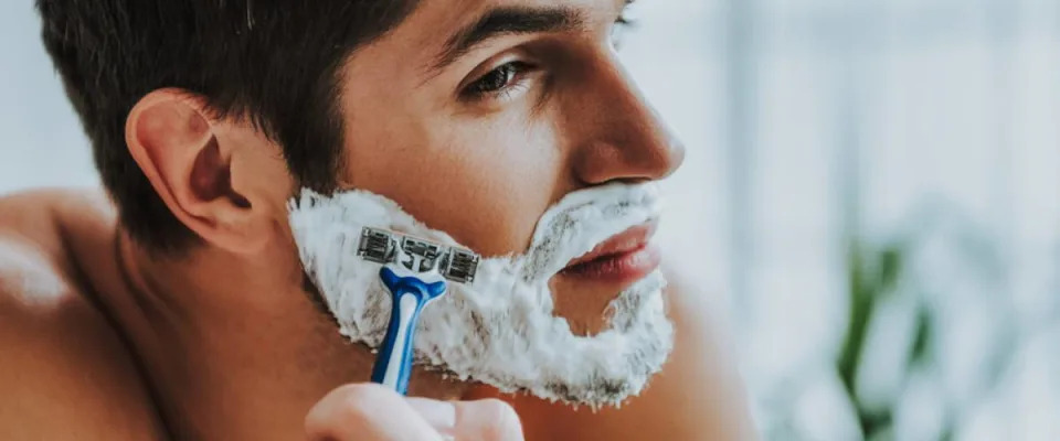 man shaving face