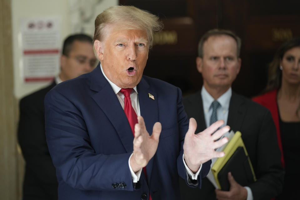 Former President Donald Trump speaks to the media during a break in his civil business fraud trial at New York Supreme Court, Tuesday, Oct. 3, 2023, in New York. Trump is in a New York court for the second day of his civil business fraud trial. A day after fiery opening statements, lawyers in the case are moving Tuesday to the plodding task of going through years' worth of Trump's financial documents. (AP Photo/Seth Wenig)