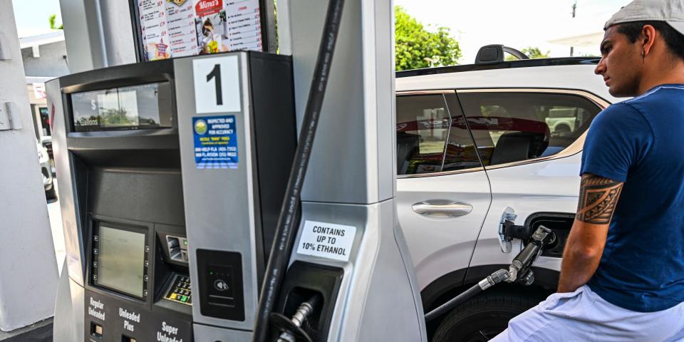 A man pumps gas into his car in Miami, Florida.