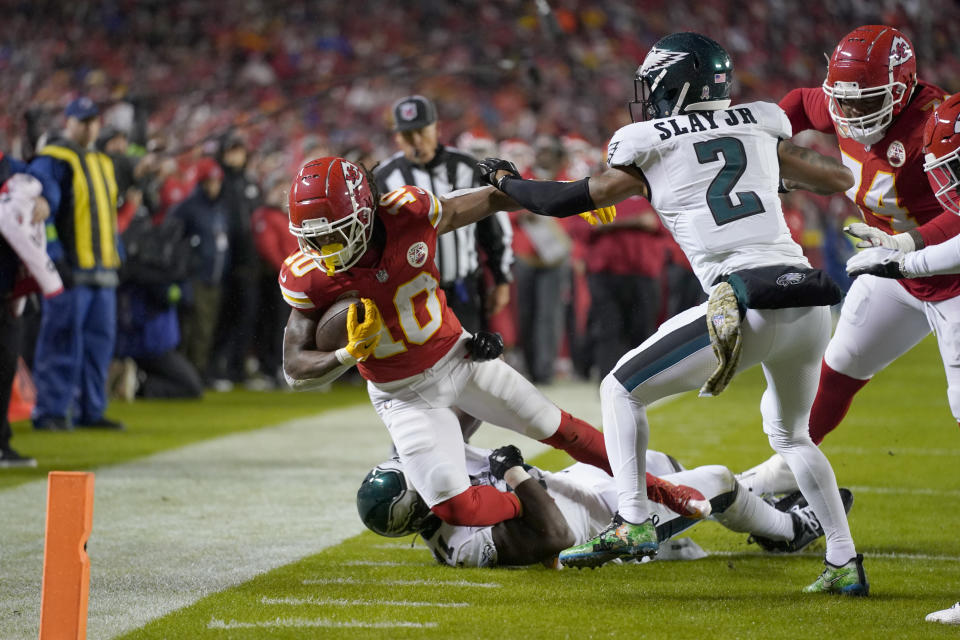 Kansas City Chiefs running back Isiah Pacheco (10) runs with the ball as Philadelphia Eagles cornerback Darius Slay (2) defends during the first half of an NFL football game, Monday, Nov. 20, 2023, in Kansas City, Mo. (AP Photo/Ed Zurga)