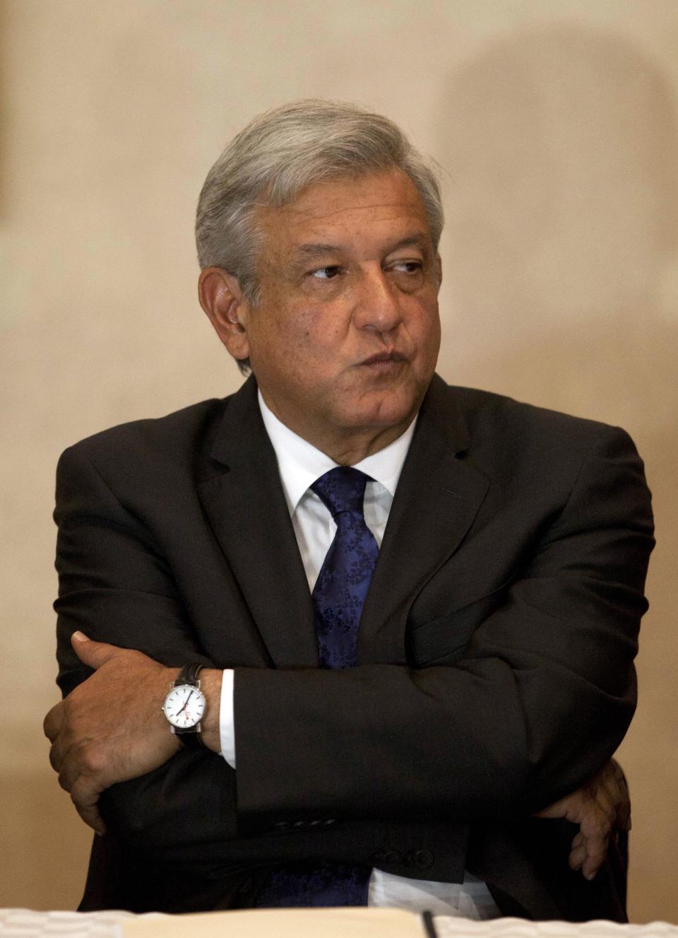 Andres Manuel Lopez Obrador, presidential candidate for the Democratic Revolution Party (PRD), attends a news conference in Mexico City, Wednesday, July 18, 2012. Lopez Obrador claims that the campaign of Enrique Pena Nieto, presidential candidate for the Revolutionary Institutional Party (PRI) engaged in overspending and vote buying. (AP Photo/Eduardo Verdugo)