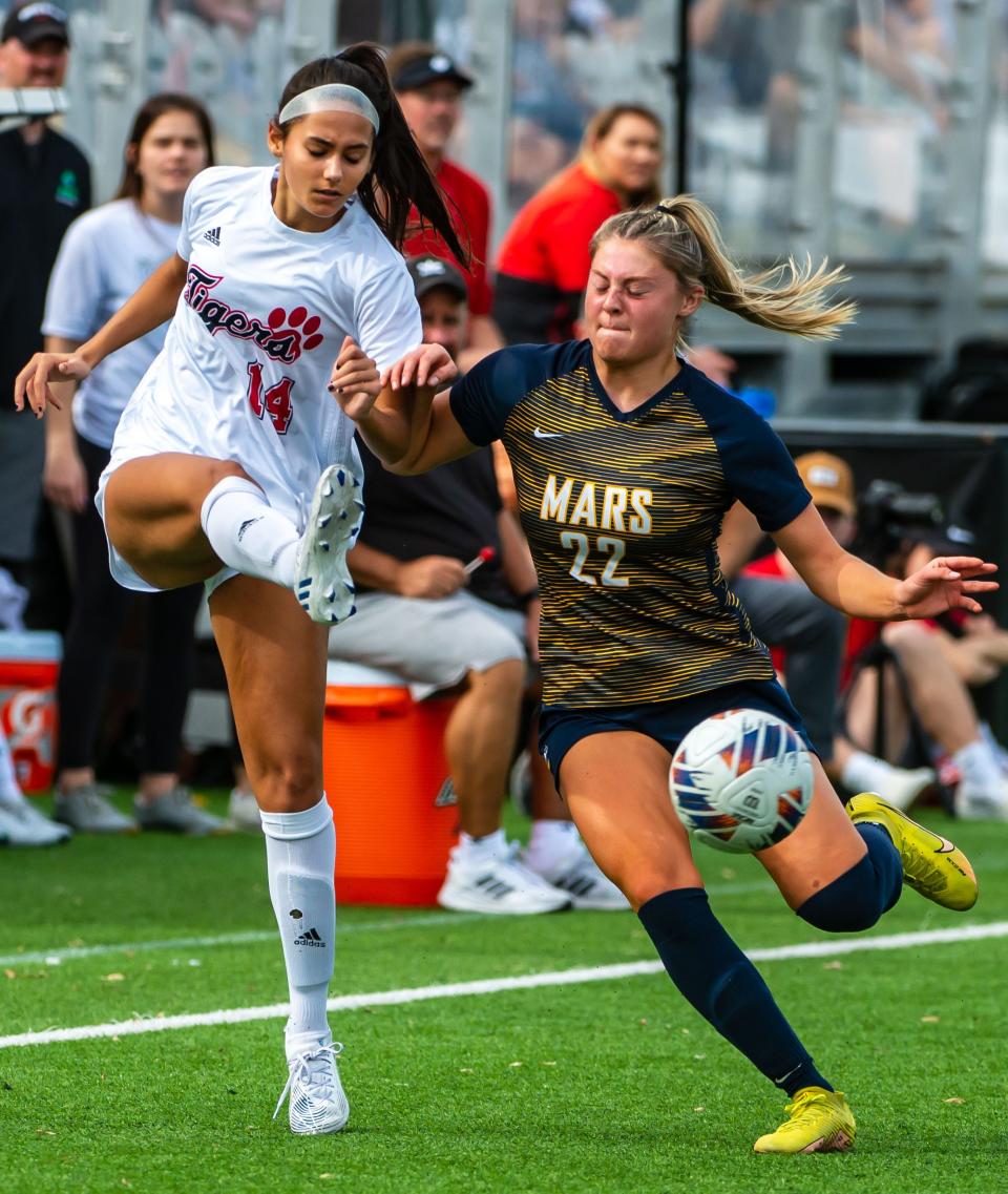 Moon High School's Skylar Leseck gives close coverage to Mars' Brooke Hamlett in the WPIAL Class 3A Championship Saturday at Highmark Stadium in Pittsburgh. [Lucy Schaly/For BCT]