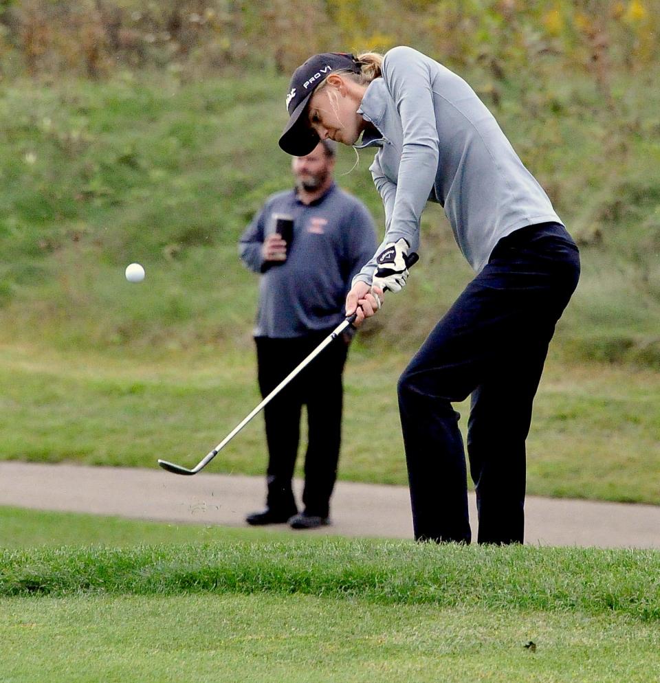 Northwestern's Kylee Purdy chips onto the green.