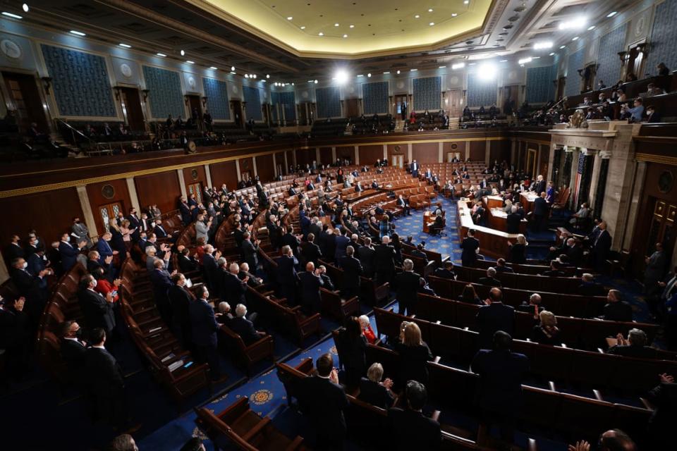 <div class="inline-image__caption"><p>Republican members stand and applaud as Speaker of the House Nancy Pelosi and Vice President Mike Pence preside over the Electoral College vote certification for President-elect Joe Biden, during a joint session of Congress at the U.S. Capitol on Jan. 6, 2021 in Washington, DC.</p></div> <div class="inline-image__credit">Kevin Dietsch-Pool/Getty Images</div>