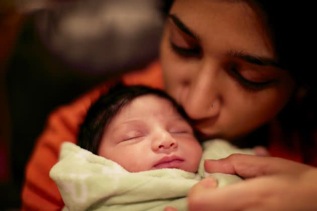 Rehma, just few days days old in January 2012, sleeping in the author's arms. (Photo: Courtesy of Nada Siddiqui)