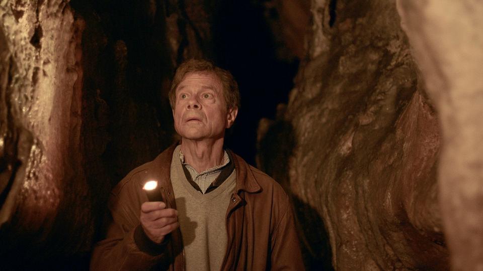 Physicist and author Alan Lightman  walks through a cave with prehistoric drawings in Les Eyzies in the Dordorgne region of France during taping for the PBS series, "SEARCHING: Our Quest for Meaning in The Age of Science."