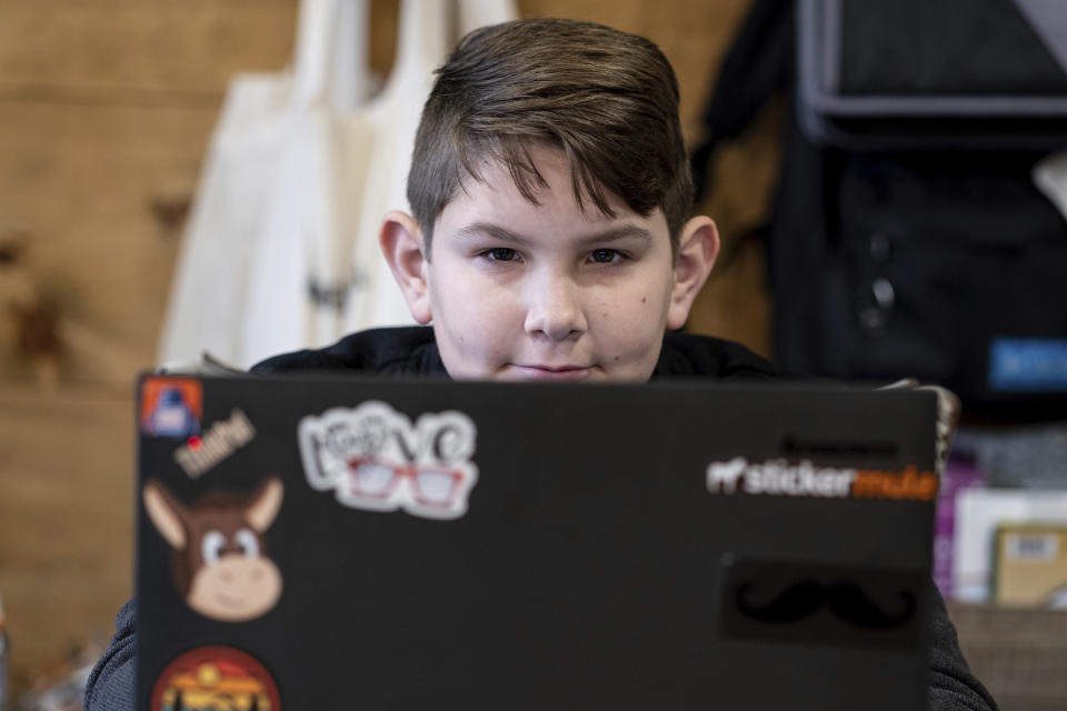 Tate Rivera is photographed at his home in Roswell, Ga., Friday, Feb. 12, 2021. Kelli Rivera is hoping a voucher bill passes that will help pay for her to move her son out of a public Cobb County school and into a private school. (AP Photo/Ben Gray)