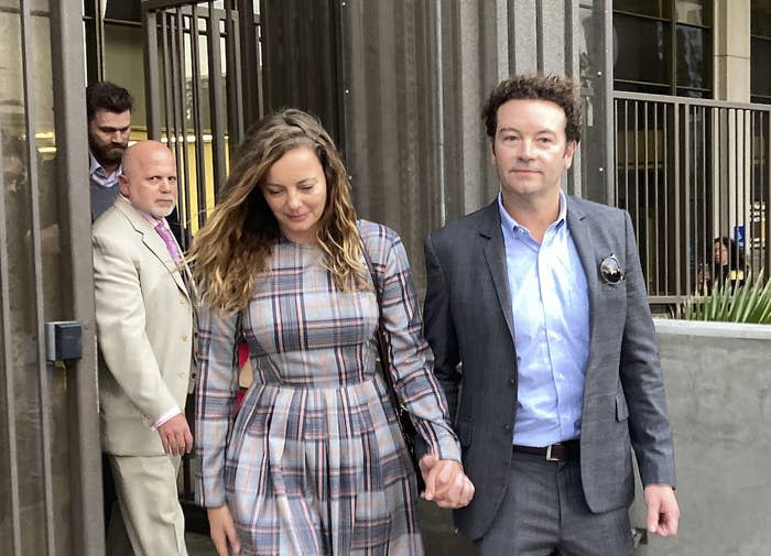 Danny Masterson leaves Los Angeles County Superior Court with his wife, Bijou Phillips, after a judge declared a mistrial in his rape case on Nov. 30, 2022.