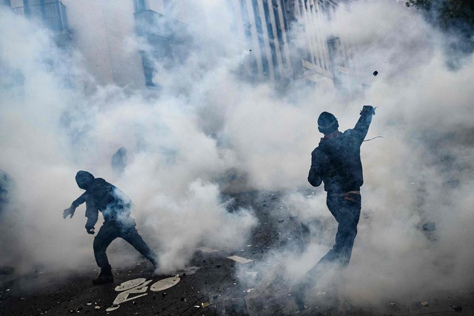 ce on the sidelines of a demonstration as part of a national day of strikes and protests, a week after the French government pushed a pensions reform through parliament without a vote, using the article 49.3 of the constitution, in Nantes, western France (AFP via Getty Images)