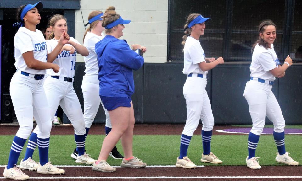 Stamford Lady Bulldogs manager Allie Caddell joins players in showing off what dance moves look like in Jones County. Across the Wells Field diamond, Forsan players had presented their own show May 27.