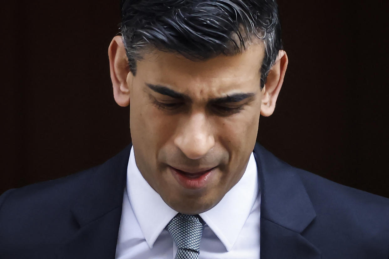 Britain's Chancellor of the Exchequer Rishi Sunak reacts as he leaves the 11 Downing Street, in London, on March 23, 2022. - Rishi Sunak will announce budget updates before parliament at about 1245 GMT, on March 23, 2022. (Photo by Tolga Akmen / AFP) (Photo by TOLGA AKMEN/AFP via Getty Images)