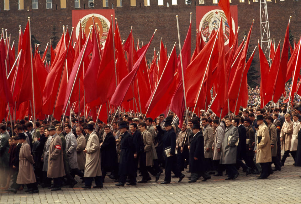 1984 | SOVIET UNION: Behind the Iron Curtain: Workers parade through Red Square on May Day. (Photo by Dean Conger) <br> <br> <a href="http://www.nationalgeographic.com/125/" rel="nofollow noopener" target="_blank" data-ylk="slk:Click here for more info at NationalGeographic.com;elm:context_link;itc:0;sec:content-canvas" class="link ">Click here for more info at NationalGeographic.com</a>