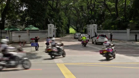 Singapore's Prime Minister Lee Hsien Loong arrives with his motorcade ahead of his meeting with U.S. President Donald Trump at the Istana in Singapore June 11, 2018 in this still image taken from Reuters TV footage. REUTERS/Reuters TV
