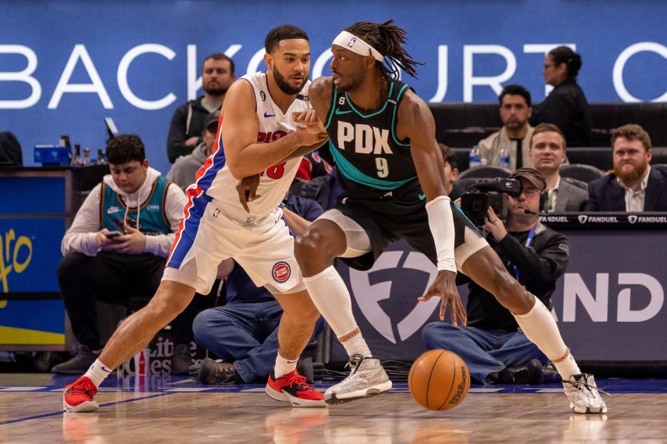 Pistons guard Cory Joseph defends against Trail Blazers forward Jerami Grant during the first half on Monday, March 6, 2023, at Little Caesars Arena.