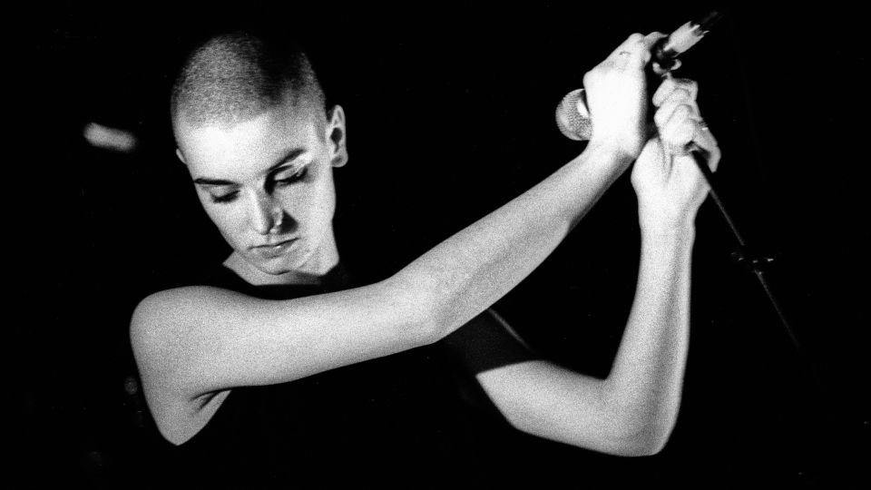 Sinéad O'Connor performs in Amsterdam, Netherlands in 1988. - Paul Bergen/Redferns/Getty Images