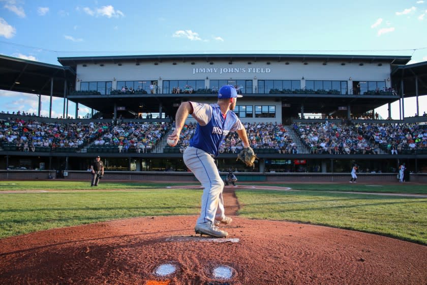A pitcher fires some warm-up balls on the mound at the United Shores Professional Baseball League field in suburban Detroit. <span class="copyright">(Matthew Cripsey / United Shore Professional Baseball League)</span>