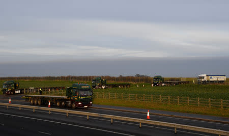 Lorries leave disused Manston Airport to attend a test drive to the Port of Dover during a trial of how road will cope in case of a "no-deal" Brexit, Kent, Britain January 7, 2019. REUTERS/Toby Melville