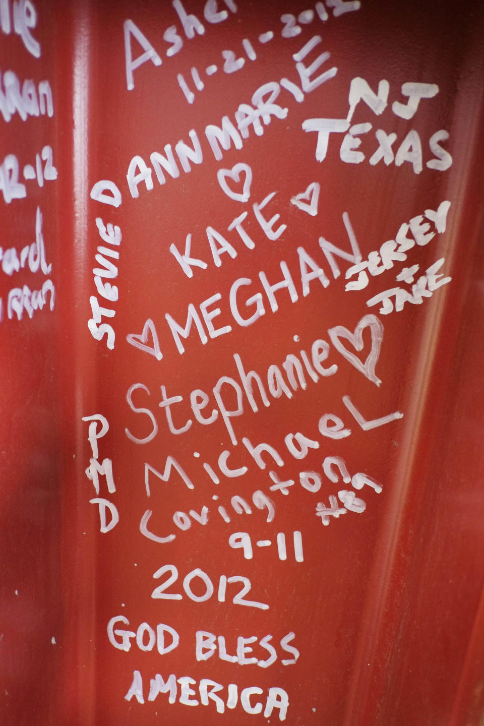 This Jan. 15, 2013 photo shows graffiti left by visitors to the World Trade Center on a steel column on the 104th floor of One World Trade Center in New York. Construction workers finishing New York's tallest building at the World Trade Center are leaving their personal marks on the concrete and steel in the form of graffiti. (AP Photo/Mark Lennihan)