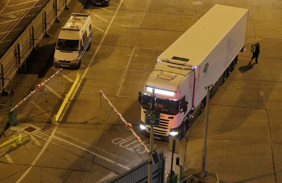 A lorry passes a barrier after disembarking the first ferry that arrived after the end of the transition period with the EU at the port in Dover, Friday, Jan. 1, 2021. Britain left the European bloc's vast single market for people, goods and services at 11 p.m. London time, midnight in Brussels, completing the biggest single economic change the country has experienced since World War II.(AP Photo/Frank Augstein)