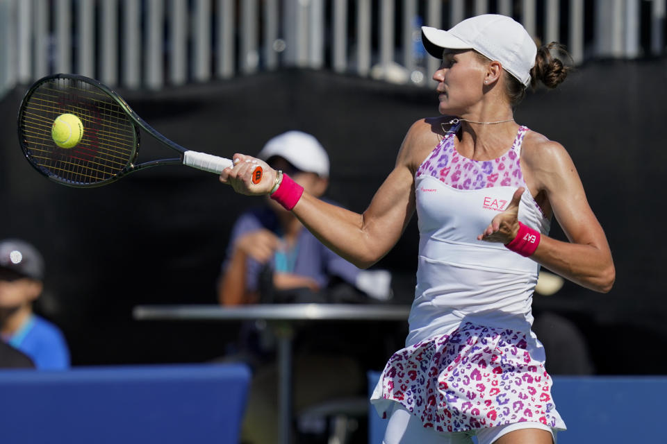 Veronika Kudermetova, of Russia, hits a forehand to Shelby Rogers, of the United States, at the Mubadala Silicon Valley Classic tennis tournament in San Jose, Calif., Saturday, Aug. 6, 2022. (AP Photo/Godofredo A. Vásquez)