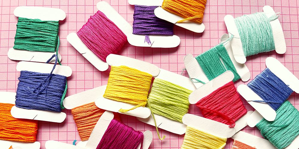 selection of colourful embroidery floss, guide to how to do embroidery stitches