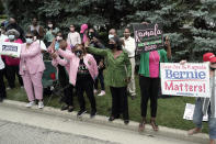 Supporters cheer as the motorcade with Democratic vice presidential candidate Sen. Kamala Harris, D-Calif., arrives at a union training facility Monday, Sept. 7, 2020, in Milwaukee. (AP Photo/Morry Gash)