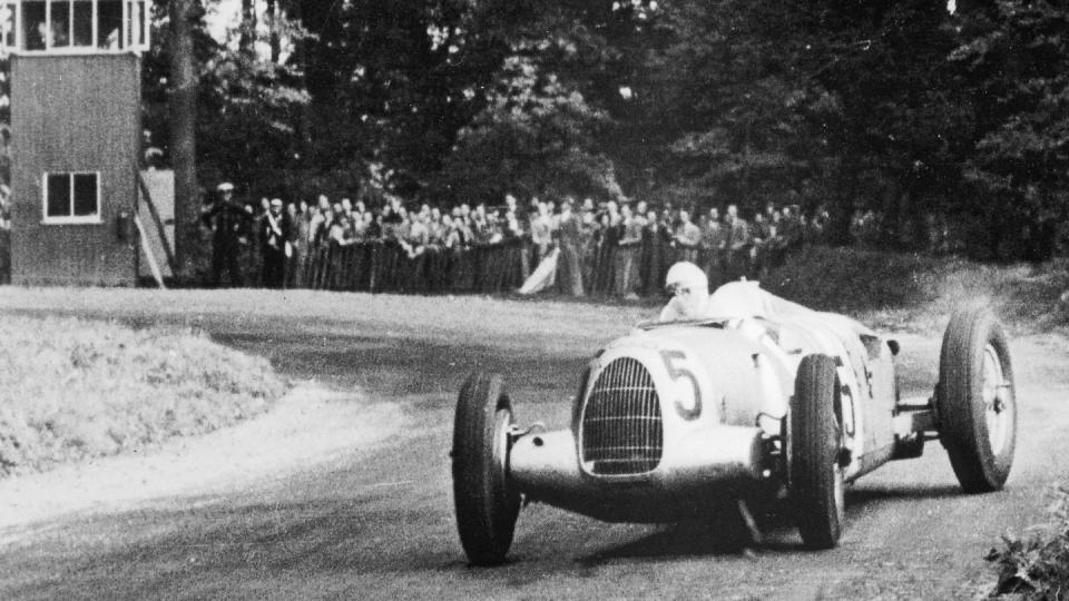 a vintage car on a road