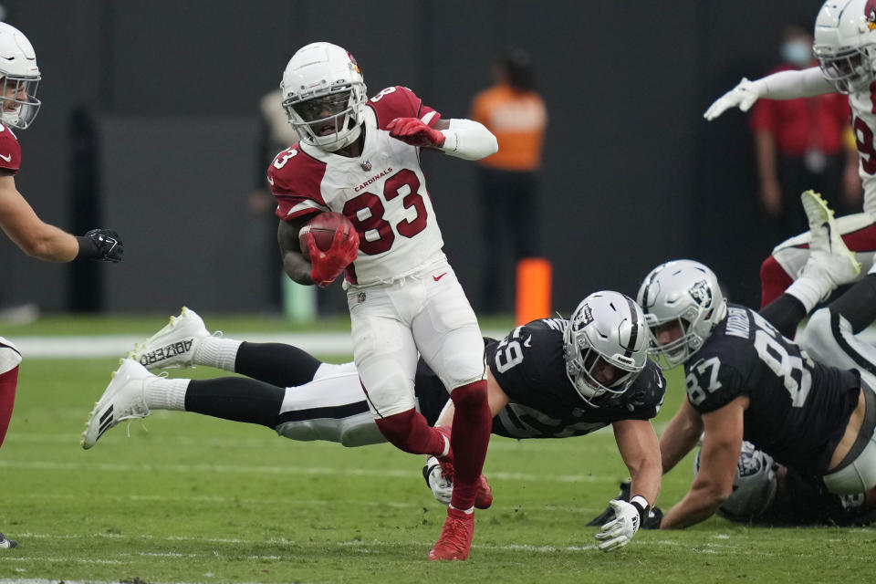 Arizona Cardinals wide receiver Greg Dortch (83) runs past Las Vegas Raiders linebacker Luke Masterson (59) during the second half of an NFL football game Sunday, Sept. 18, 2022, in Las Vegas. (AP Photo/John Locher)