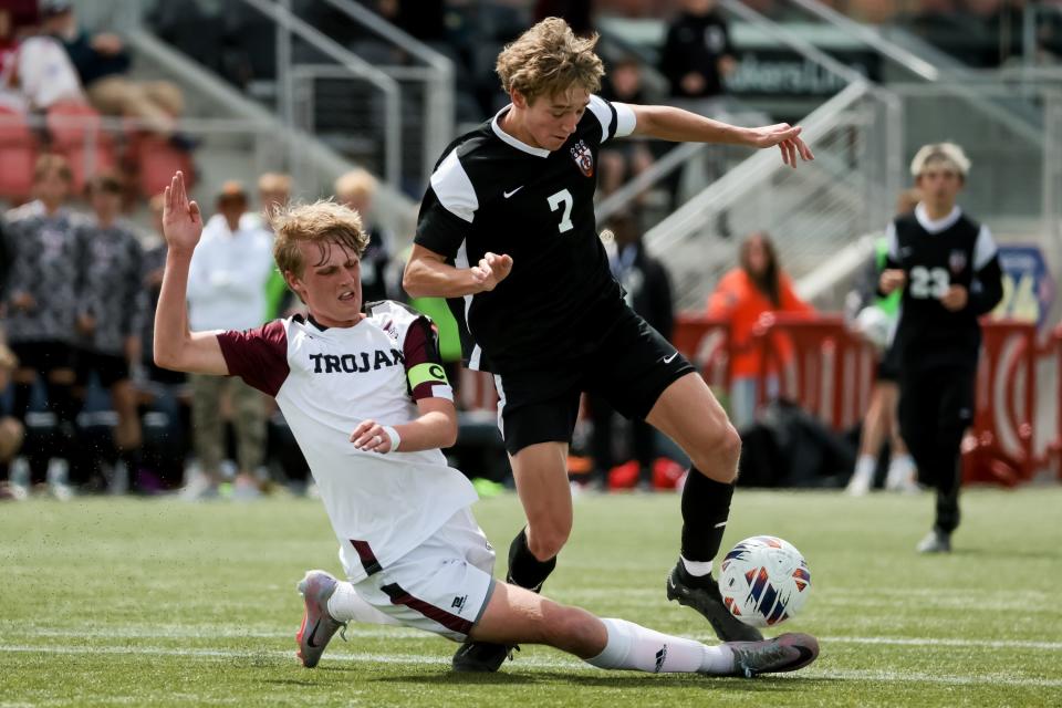 Morgan’s Tyson Adams attacks as Ogden’s Brigham Aardema moves the ball in a 3A boys soccer state semifinal at Zions Bank Stadium in Herriman on Wednesday, May 10, 2023. | Spenser Heaps, Deseret News