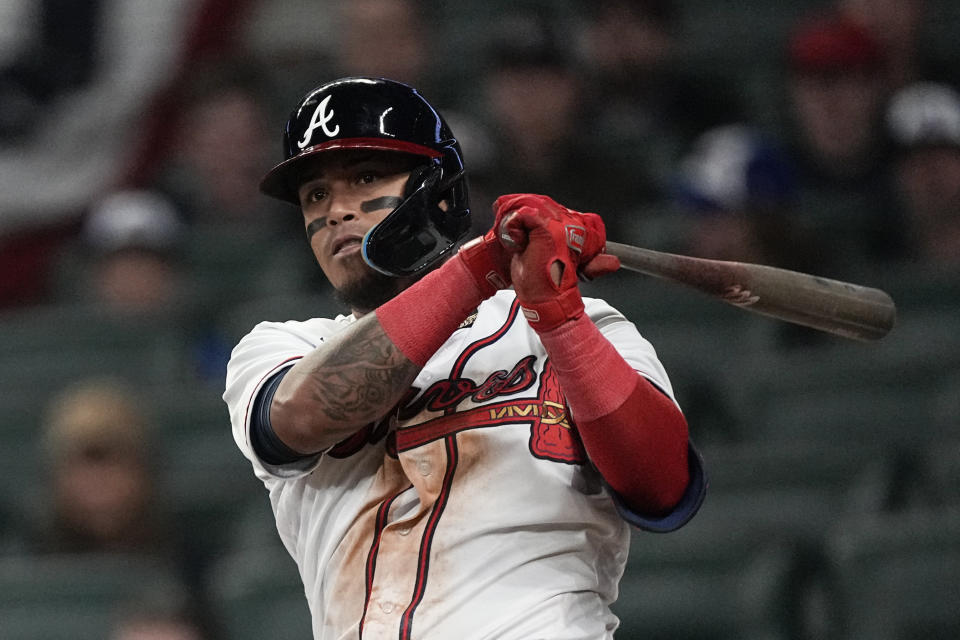 Atlanta Braves' Orlando Arcia drives in a run with a single in the eighth inning of a baseball game against the Cincinnati Reds, Monday, April 10, 2023, in Atlanta. (AP Photo/John Bazemore)