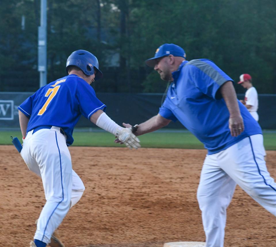 Piedmont's Jack Hayes (left) gets a high-five following a three-run home run during a high school baseball game against Westbrook Christian on April 19, 2022 in Rainbow City, Alabama. Ehsan Kassim/Gadsden Times.
