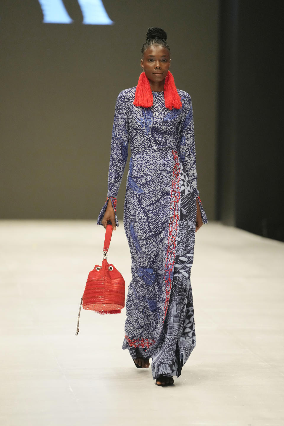 A model wears a creation by Ladymaker during the Lagos Fashion Week in Lagos, Nigeria, Thursday, Oct. 26, 2023. Africa's fashion industry is rapidly growing to meet local and international demands but a lack of adequate investment still limits its full potential, UNESCO said Thursday in its new report released at this year's Lagos Fashion Week show. (AP Photo/Sunday Alamba)