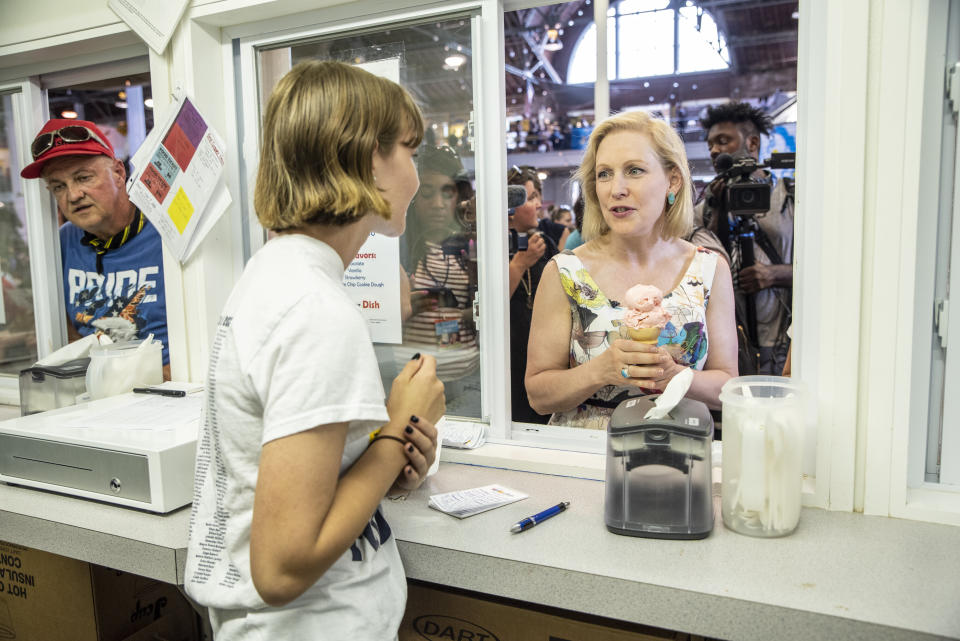 Sen. Kristen Gillibrand (D-N.Y.) has ice cream at the state fair on Aug. 10. Gillibrand pulled the plug on her presidential bid on Wednesday.