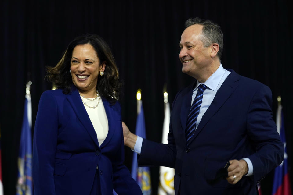 Sen. Kamala Harris, D-Calif., and her husband Douglas Emhoff look over to Democratic presidential candidate former Vice President Joe Biden and his wife Jill Biden after a campaign event at Alexis Dupont High School in Wilmington, Del., Wednesday, Aug. 12, 2020. (AP Photo/Carolyn Kaster)