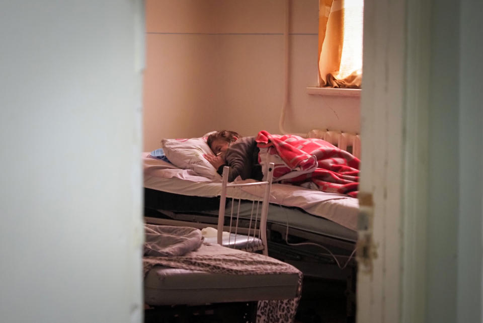 A coronavirus patient lies in an infectious diseases clinic in Stepanakert, the separatist region of Nagorno-Karabakh, Tuesday, Oct. 20, 2020. Nagorno-Karabakh, which lies within Azerbaijan but has been under the control of ethnic Armenian forces since a war there ended in 1994, faces an outbreak of the coronavirus amid the largest outbreak of hostilities in more than a quarter-century. (AP Photo)