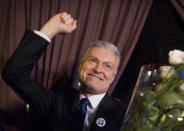 Economist Gitanas Nauseda, a presidential candidate, celebrates winning the second round of Lithuania's presidential election, in Vilnius, Lithuania, Sunday, May 26, 2019. (AP Photo/Mindaugas Kulbis)