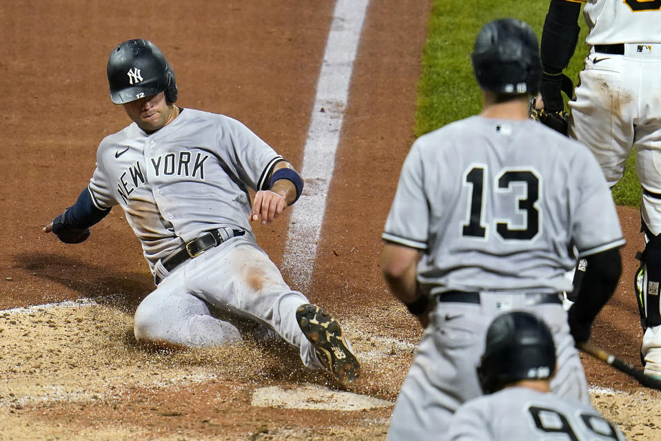 New York Yankees' Isiah Kiner-Falefa (12) scores the second of two runs on a single by DJ LeMahieu off Pittsburgh Pirates starting pitcher Mitch Keller during the fifth inning of a baseball game in Pittsburgh, Wednesday, July 6, 2022. (AP Photo/Gene J. Puskar)