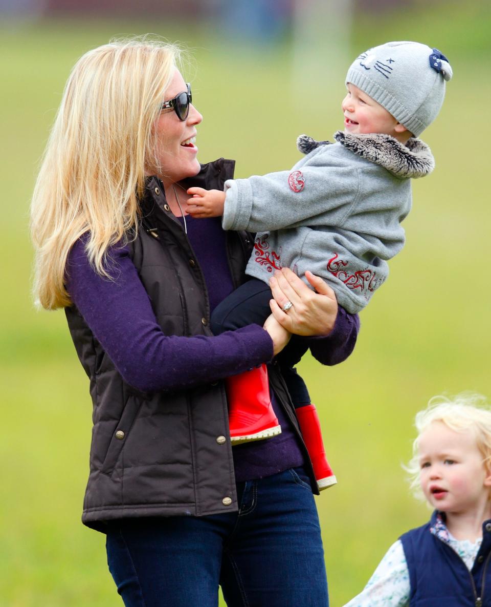 Princess Anne’s son Peter Phillips was the first of Queen Elizabeth II’s grandchildren to marry. He met Autumn Kelly at the 2003 Canadian Grand Prix and proposed with a platinum ring containing an oval center diamond with more diamonds on either side.