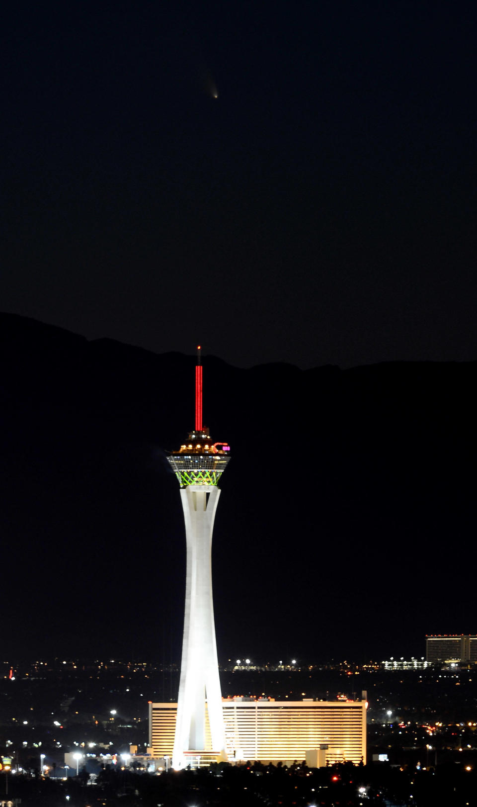 LAS VEGAS, NV - MARCH 12:  The comet PanSTARRS passes over the Stratosphere Casino Hotel on March 12, 2013 in Las Vegas, Nevada. Officially known as C/2011 L4, the comet got its name after being discovered by astronomers using the Panoramic Survey Telescope & Rapid Response System (Pan-STARRS) telescope in Hawaii in June 2011.  (Photo by Ethan Miller/Getty Images)