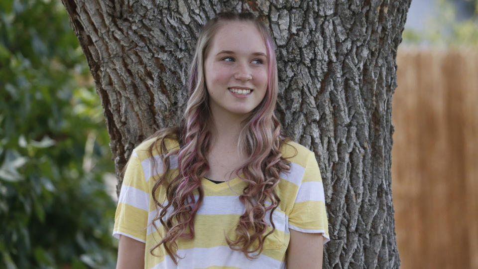 High school student Brianne Harmon is shown Monday, Aug. 10, 2020, in Magna, Utah. Harmon, 16, struggled at the end of last school year as she tried to find a quiet place to work in a remote school in a house with several relatives. She was in danger of failing three classes but after a series of sleepless nights, she managed to catch up, allowing her to continue with the drill team, a sport she loves. (AP Photo/Rick Bowmer)